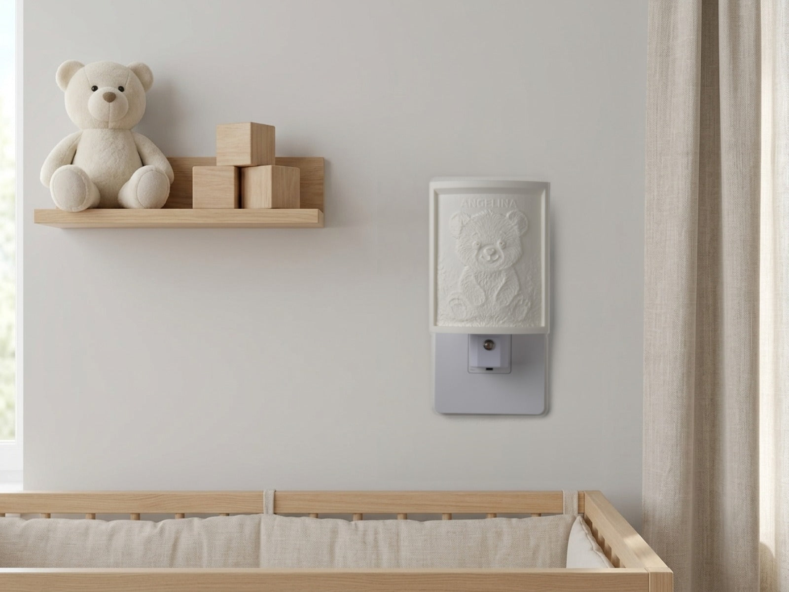 The night light switched off in a bright nursery β a soft ivory panel by day, the name Angelina sculpted at the top
