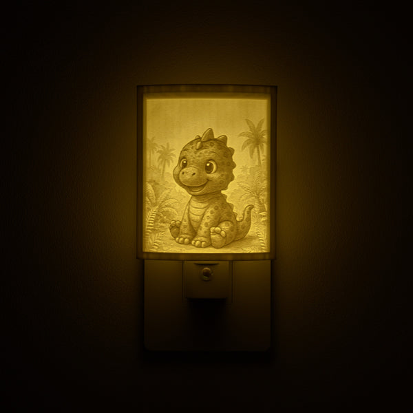 Dinosaur night light glowing against a dark wall, plugged into an outlet
