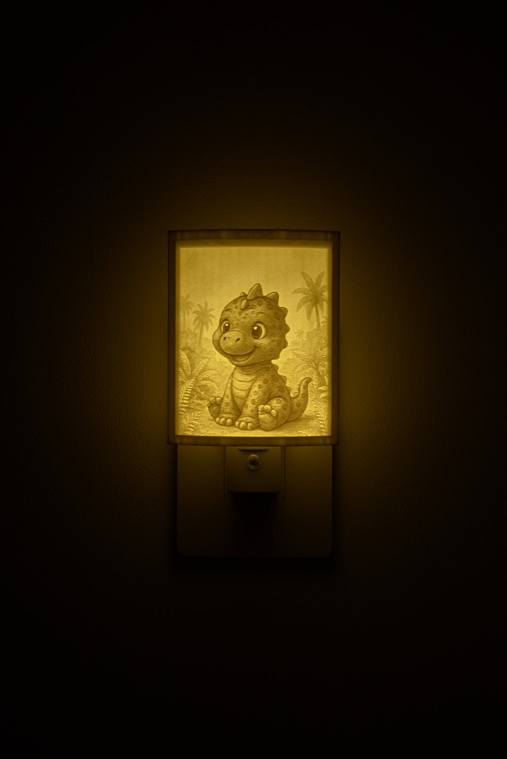 Dinosaur night light glowing against a dark wall, plugged into an outlet