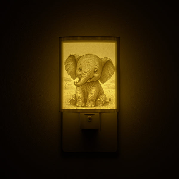 Elephant night light glowing against a dark wall, plugged into an outlet