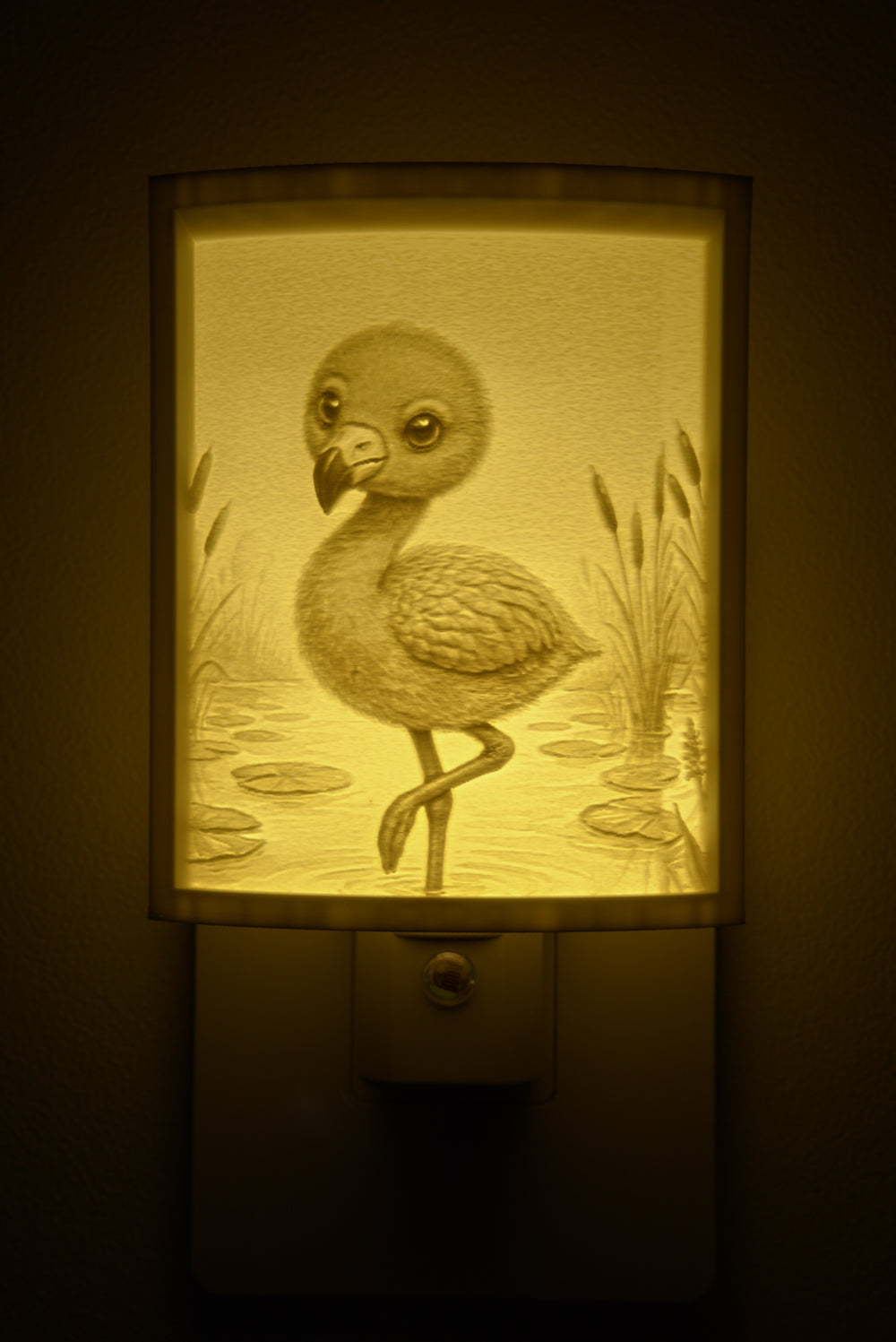 Close-up of the flamingo design in warm light