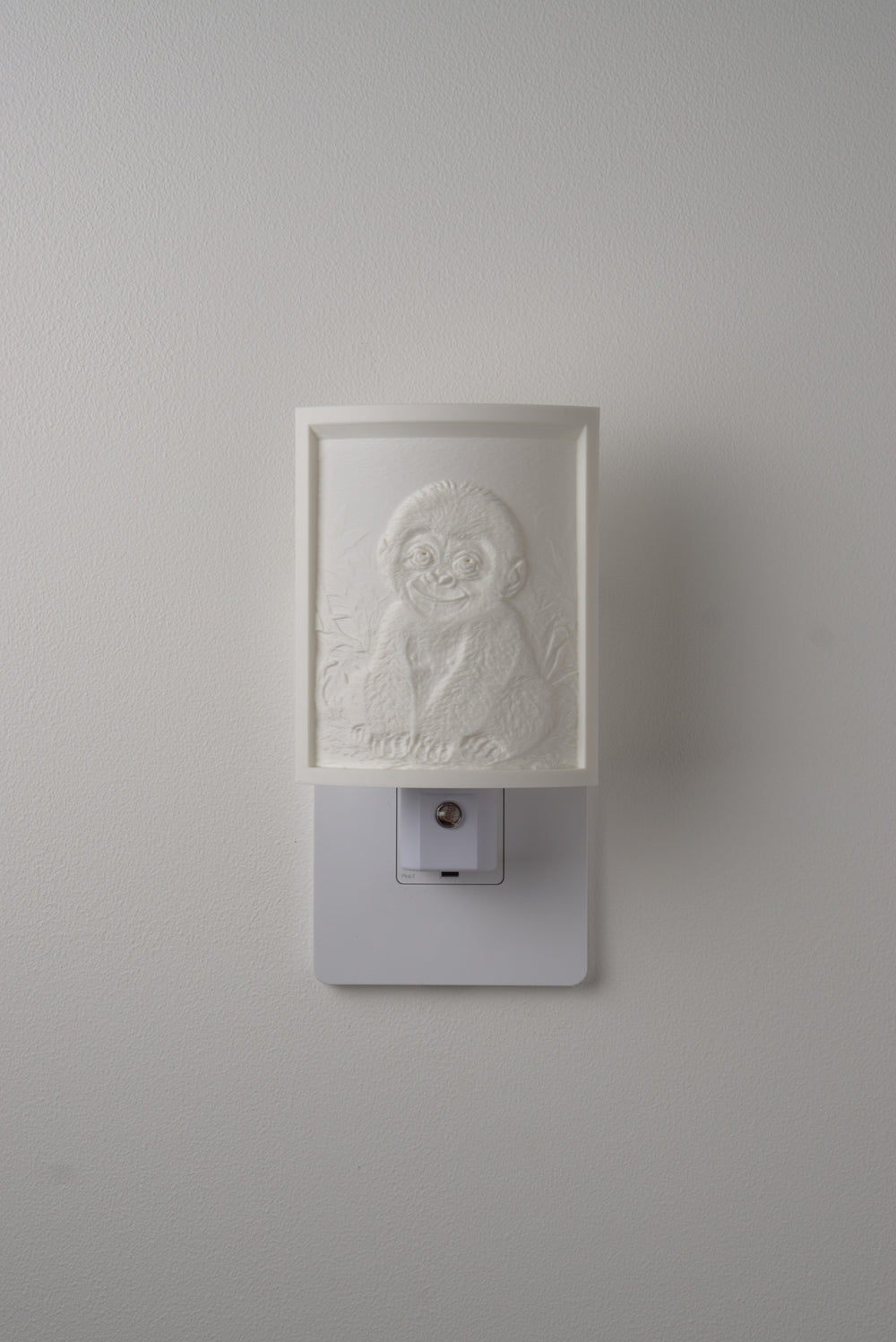 Gorilla night light switched off — a soft ivory panel by day