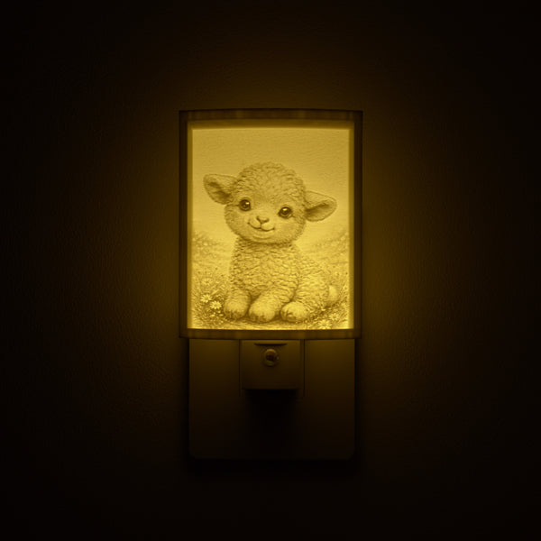 Lamb night light glowing against a dark wall, plugged into an outlet