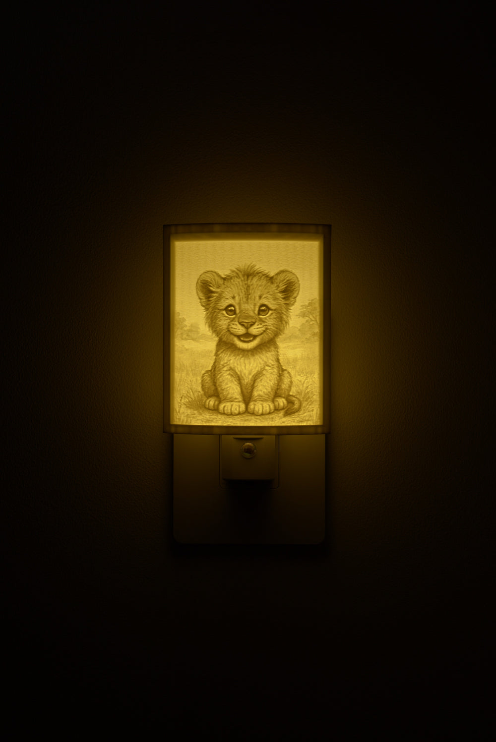 Lion night light glowing against a dark wall, plugged into an outlet