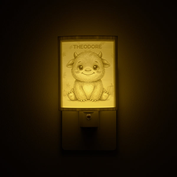 Little Monster night light glowing with the name THEODORE sculpted into the panel