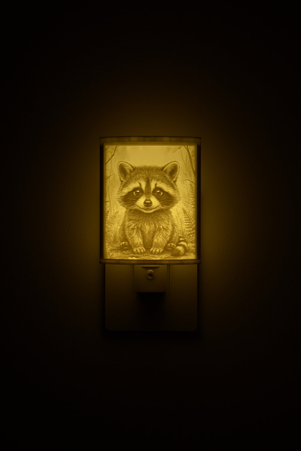 Raccoon night light glowing against a dark wall, plugged into an outlet