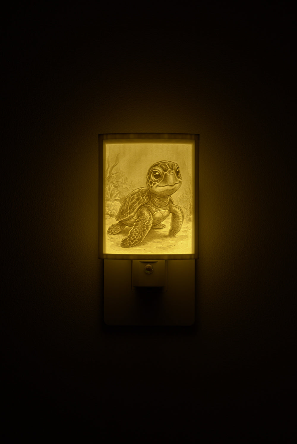 Sea Turtle night light glowing against a dark wall, plugged into an outlet