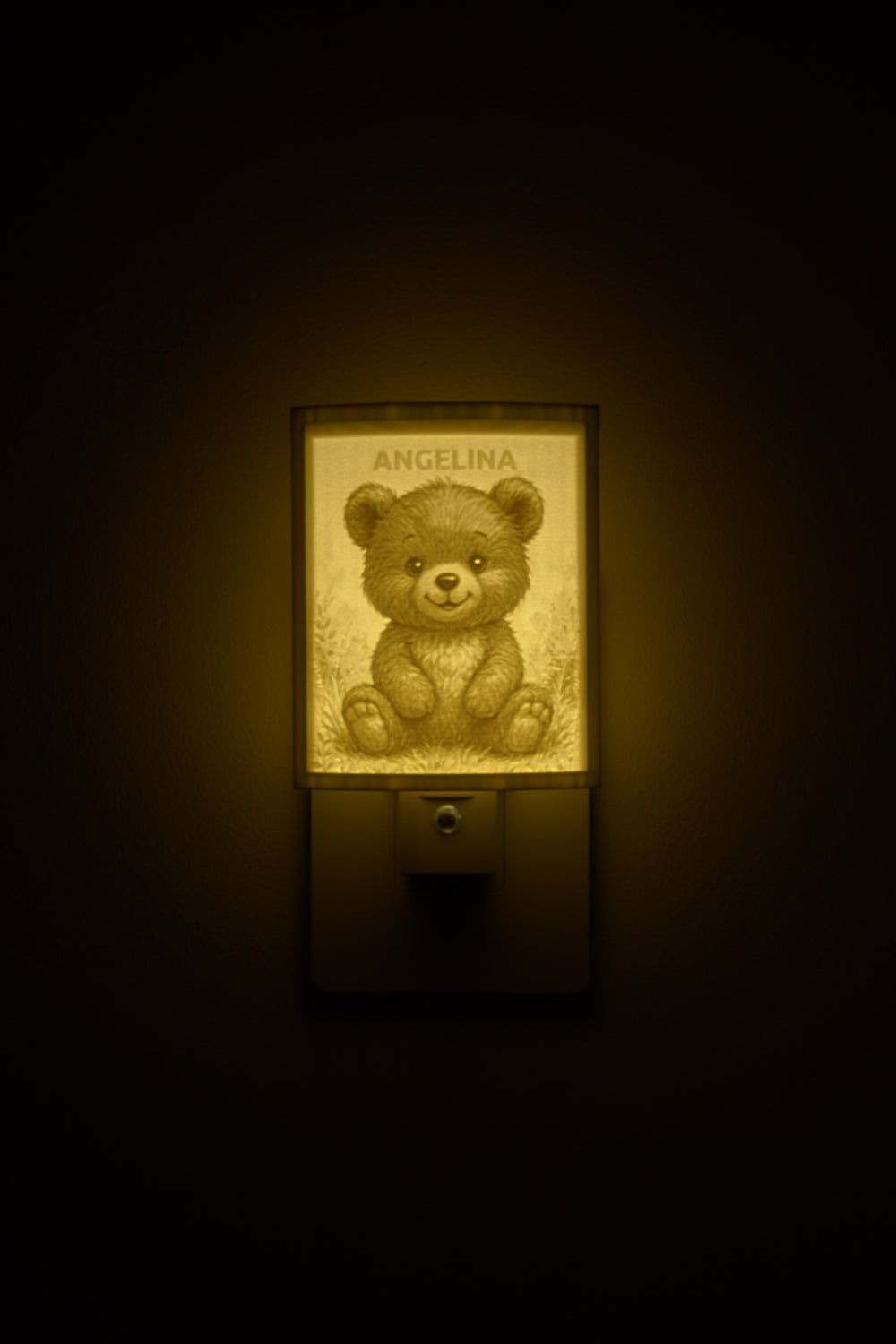Teddy bear night light glowing with the name ANGELINA