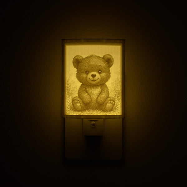 Teddy Bear night light glowing against a dark wall, plugged into an outlet