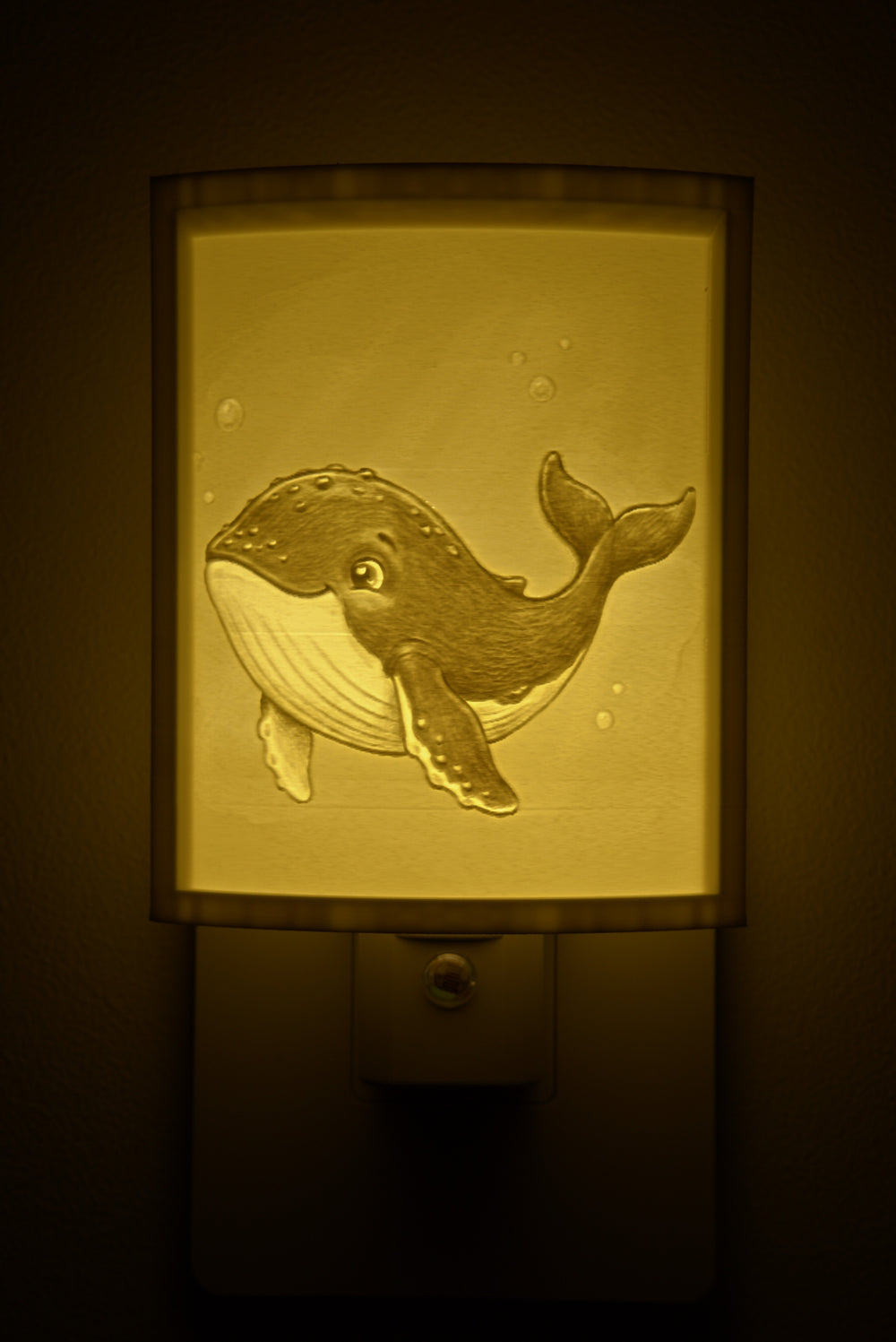 Close-up of the whale design in warm light